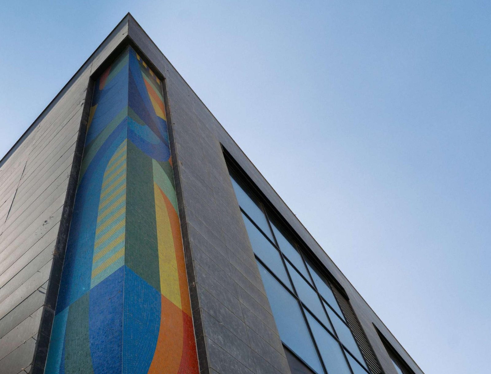 A SKYWALK building corner with its mosaic facade